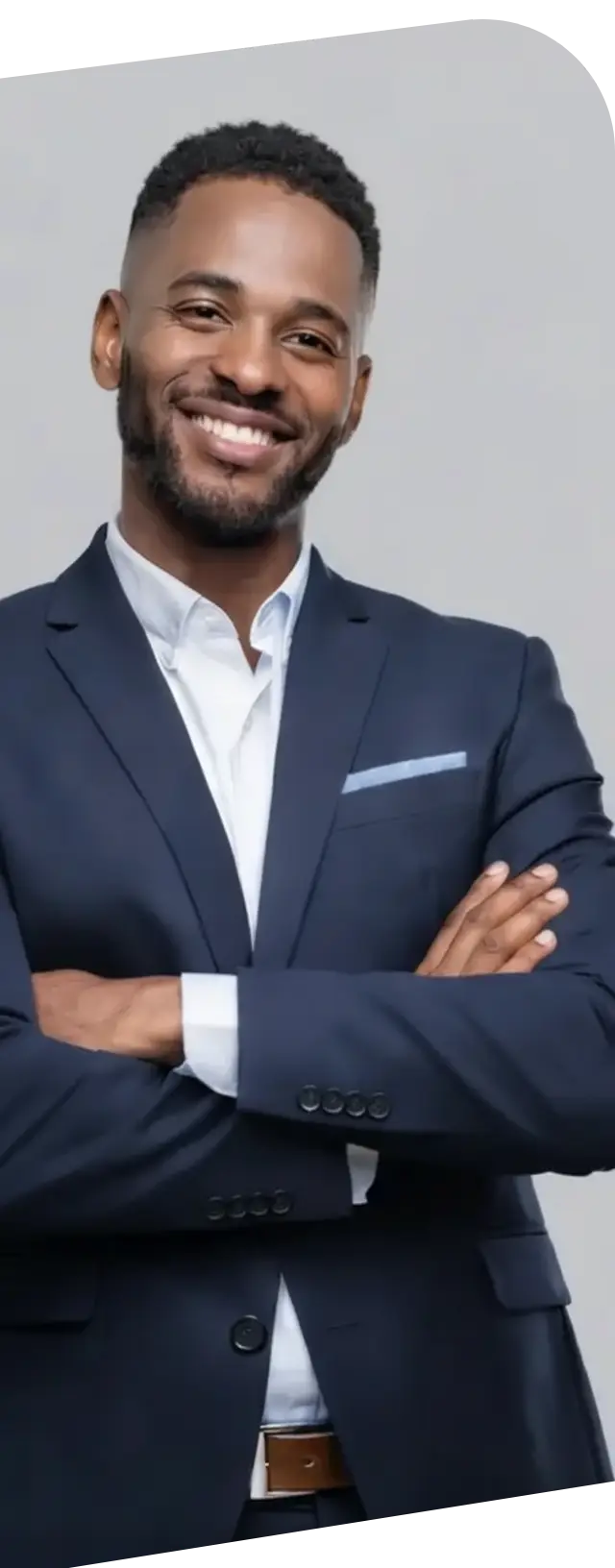 A smiling professional brand strategist in a navy suit with crossed arms - representing smarter insights for rapid brand development.